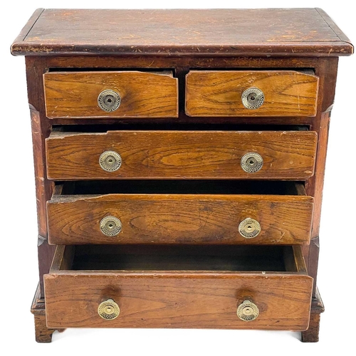 72 - A 19th elm small chest or collector's cabinet. 19th century, fitted with two short and three long dr... 