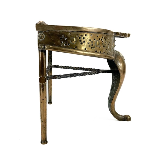 73 - A George III heavy brass and wrought iron footman. With scroll pierced top, with a cabriole front su... 