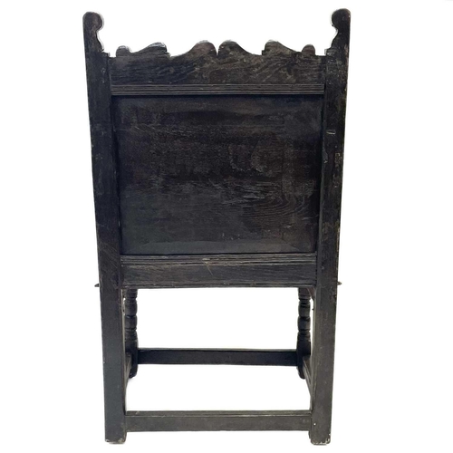 77 - A 17th century oak North Country Wainscot armchair. With a shaped top rail carved central lozenge, h... 