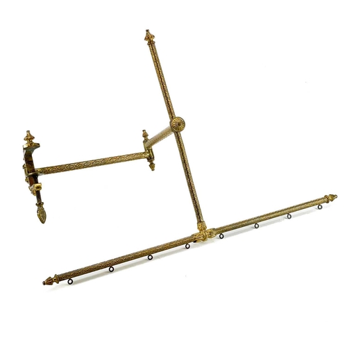 81 - A gilt metal tapestry adjustable frame with ornate clamp. Extended length 80cm.