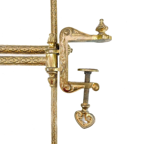 81 - A gilt metal tapestry adjustable frame with ornate clamp. Extended length 80cm.