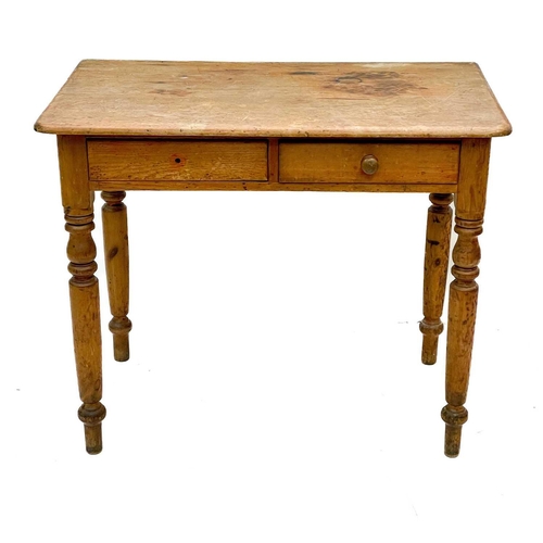 85 - A Victorian pine side table. With two short drawers on turned supports, height 75cm width 91cm depth... 