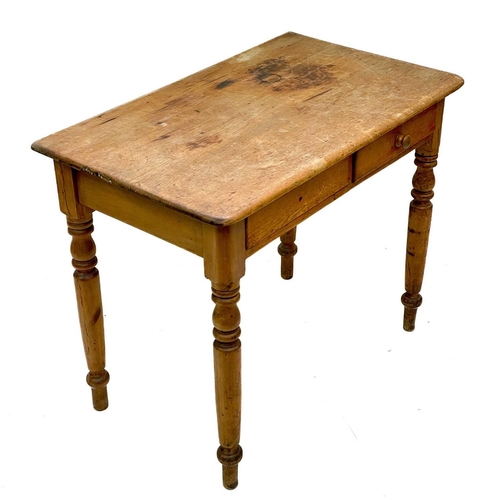 85 - A Victorian pine side table. With two short drawers on turned supports, height 75cm width 91cm depth... 