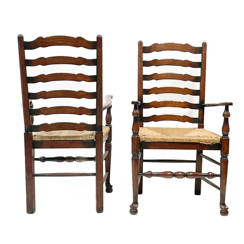 87 - Six 20th century ash and oak ladder back chairs. With drop in rush seats and two carvers. (6)Stirdy,... 