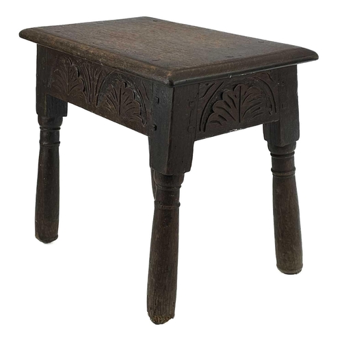 90 - An oak joint stool. 17th century style, with lunette carved frieze, on turned legs (reduced), height... 