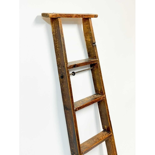 92 - An early 20th century pine library ladder. Height 205cm width 43cm depth 7cm.