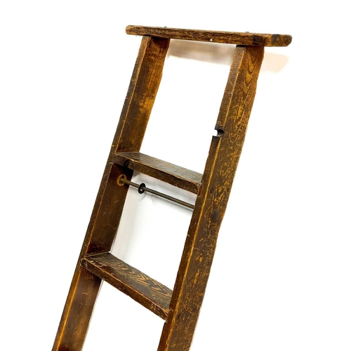 92 - An early 20th century pine library ladder. Height 205cm width 43cm depth 7cm.