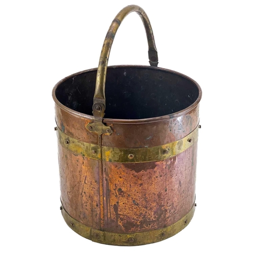 93 - A brass bound copper log bin. Height 32cm diameter 32cm.