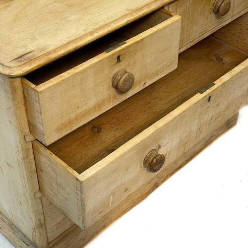 95 - A 19th century pine chest of drawers. With two short and two short drawers on a plinth base, height ... 