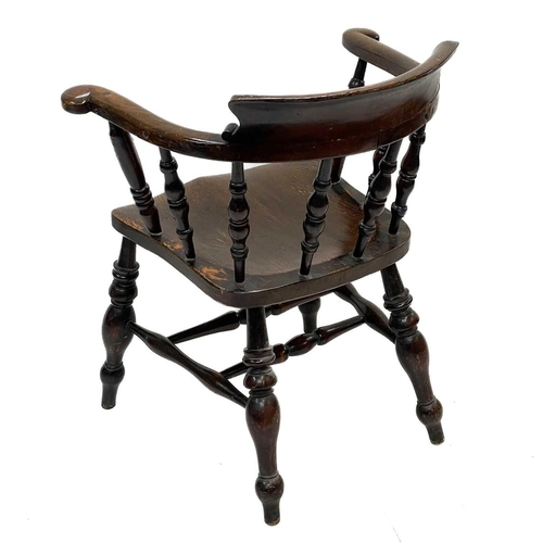 97 - A Victorian oak bow smokers chair. Height 81cm width 67cm depth 56cm.