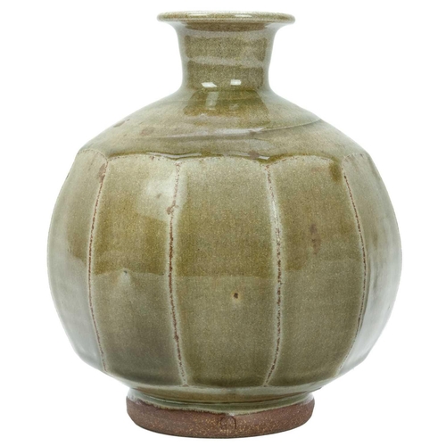 551 - Phil ROGERS (1951-2020) Cut-Sided Vase  A stoneware ovoid cut-sided bottle vase with celadon glaze, ... 