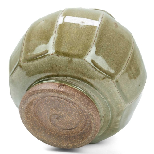 551 - Phil ROGERS (1951-2020) Cut-Sided Vase  A stoneware ovoid cut-sided bottle vase with celadon glaze, ... 