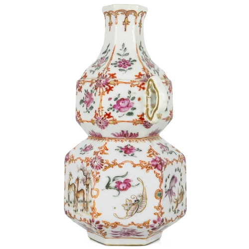 131 - A Chinese famille rose porcelain double gourd vase, circa 1760. With twin handles and decorated with... 