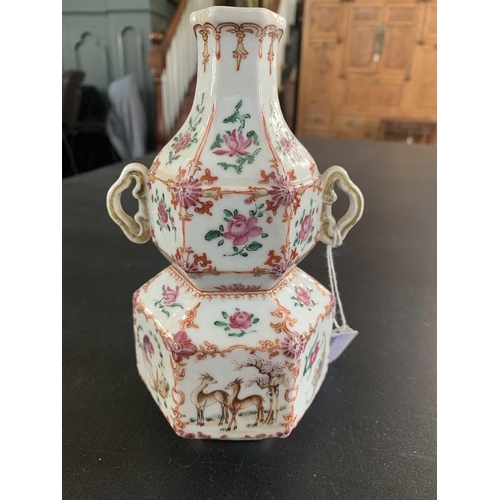 131 - A Chinese famille rose porcelain double gourd vase, circa 1760. With twin handles and decorated with... 