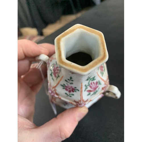 131 - A Chinese famille rose porcelain double gourd vase, circa 1760. With twin handles and decorated with... 