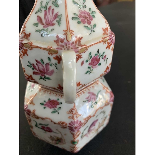 131 - A Chinese famille rose porcelain double gourd vase, circa 1760. With twin handles and decorated with... 