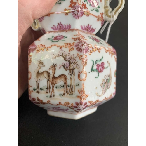 131 - A Chinese famille rose porcelain double gourd vase, circa 1760. With twin handles and decorated with... 