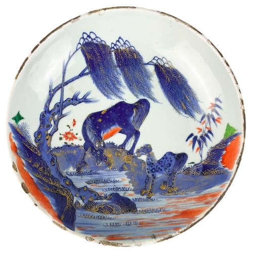 141 - A Chinese Imari porcelain dish, 18th century. With horses in a landscape and standing beneath a will... 