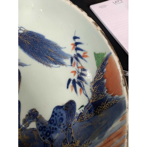 141 - A Chinese Imari porcelain dish, 18th century. With horses in a landscape and standing beneath a will... 