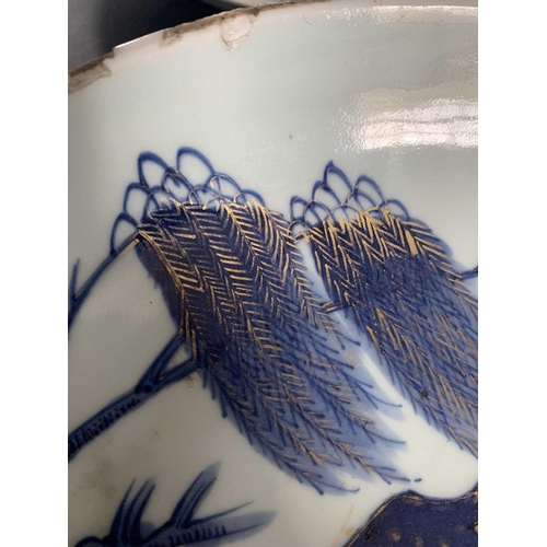 141 - A Chinese Imari porcelain dish, 18th century. With horses in a landscape and standing beneath a will... 