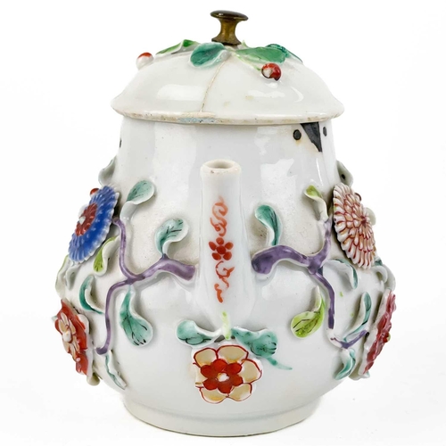 144 - A Chinese porcelain teapot, mid 18th century. .With applied floral and leaf decoration, height 12cm,... 