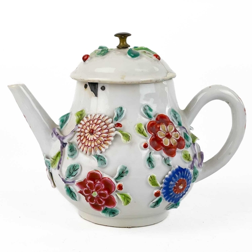 144 - A Chinese porcelain teapot, mid 18th century. .With applied floral and leaf decoration, height 12cm,... 