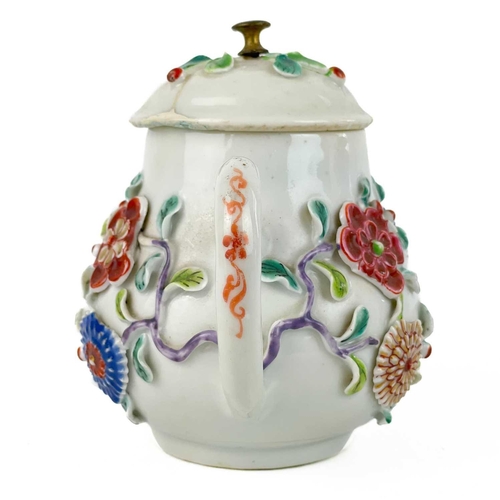 144 - A Chinese porcelain teapot, mid 18th century. .With applied floral and leaf decoration, height 12cm,... 