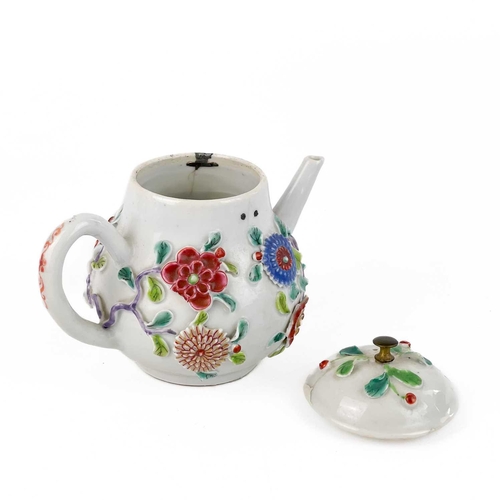 144 - A Chinese porcelain teapot, mid 18th century. .With applied floral and leaf decoration, height 12cm,... 