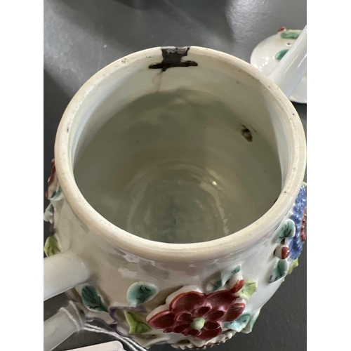 144 - A Chinese porcelain teapot, mid 18th century. .With applied floral and leaf decoration, height 12cm,... 