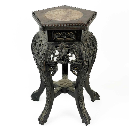 164 - A Chinese carved hardwood jardiniere stand, 19th century. With marble inset top, height 46cm, width ... 