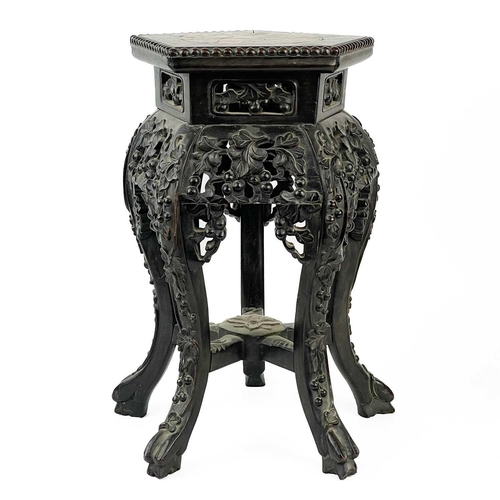164 - A Chinese carved hardwood jardiniere stand, 19th century. With marble inset top, height 46cm, width ... 