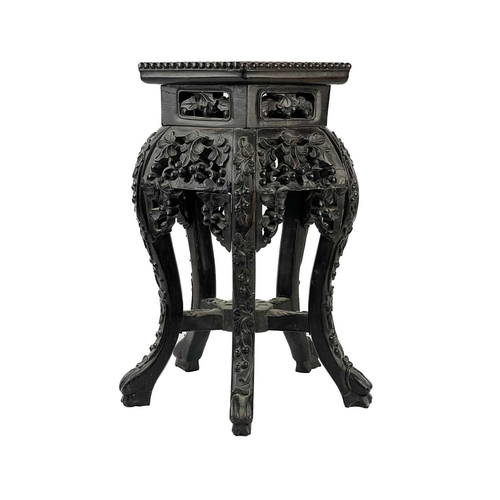 164 - A Chinese carved hardwood jardiniere stand, 19th century. With marble inset top, height 46cm, width ... 