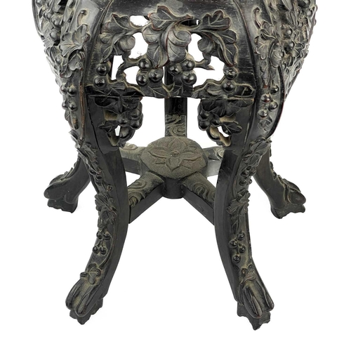 164 - A Chinese carved hardwood jardiniere stand, 19th century. With marble inset top, height 46cm, width ... 