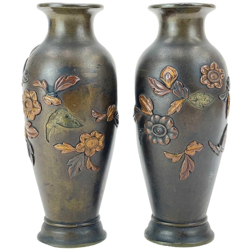 10 - A pair of Japanese bronze vases. Circa 1900, of baluster form, inlaid with gilt copper and other met... 