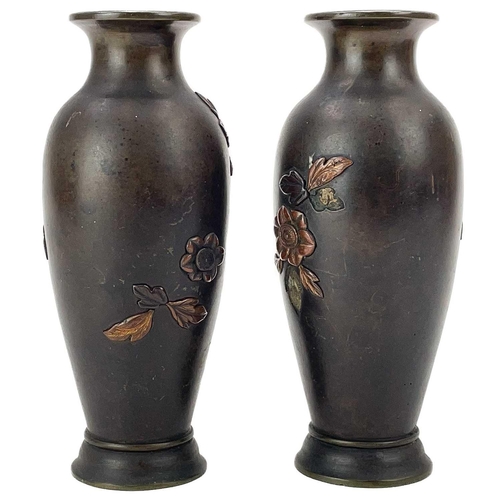 10 - A pair of Japanese bronze vases. Circa 1900, of baluster form, inlaid with gilt copper and other met... 