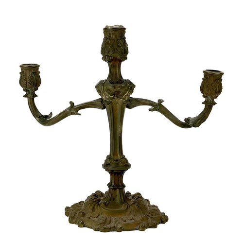 101 - A pair of rococo style ormolu candelabra. Possibly English, circa 1820, each with twin branches, the... 