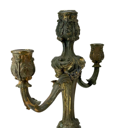 101 - A pair of rococo style ormolu candelabra. Possibly English, circa 1820, each with twin branches, the... 