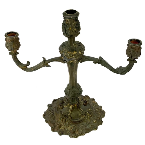 101 - A pair of rococo style ormolu candelabra. Possibly English, circa 1820, each with twin branches, the... 