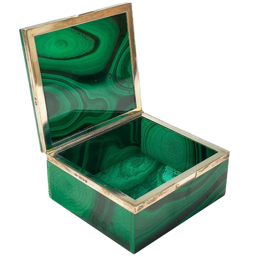 12 - A silver mounted rectangular malachite hinged box. The mounts marked for Geo Betjemann & Sons Ltd, L... 