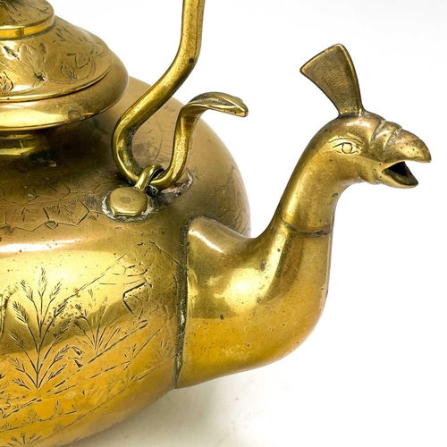 122 - An unusual Eastern brass kettle and stand. The kettle with peacock head spout, engraved with warring... 