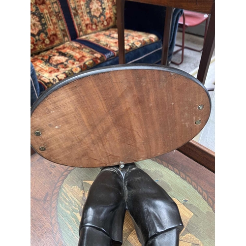 125 - A carved ebony table waiter. 19th century, the figure holding a tray, on a rectangular base, height ... 