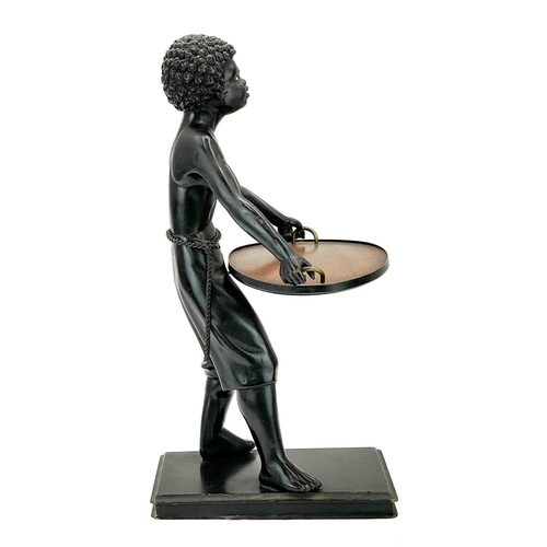 125 - A carved ebony table waiter. 19th century, the figure holding a tray, on a rectangular base, height ... 