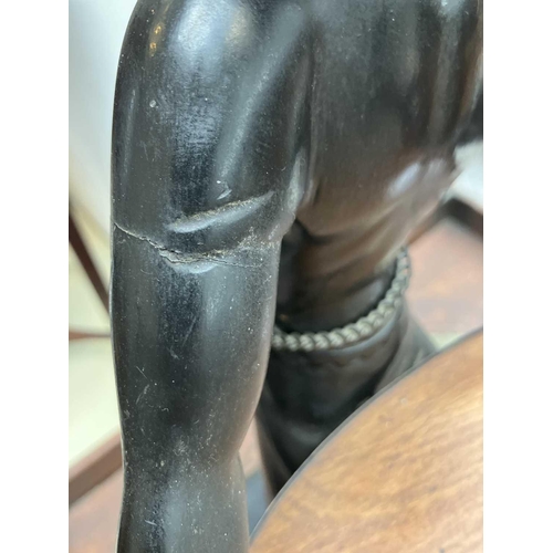 125 - A carved ebony table waiter. 19th century, the figure holding a tray, on a rectangular base, height ... 