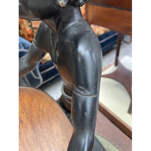 125 - A carved ebony table waiter. 19th century, the figure holding a tray, on a rectangular base, height ... 