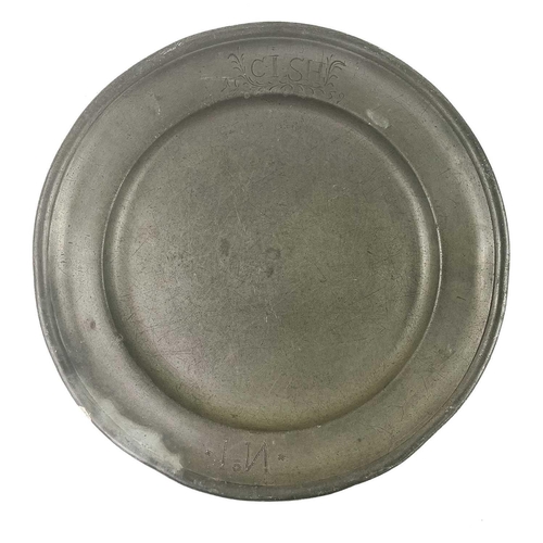 140 - A pewter plate marked 1759 inscribed with the owner's initials. Diameter - 22.5cm together with two ... 