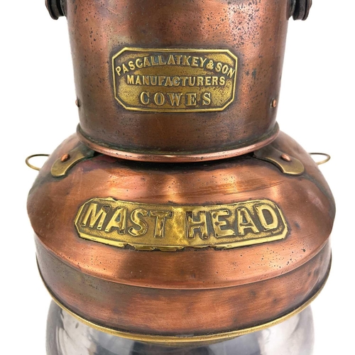 144 - A ship's copper mast head lamp. By Pascall Atkey & Son, Manufacturers, Cowes, with oil burner, heigh... 