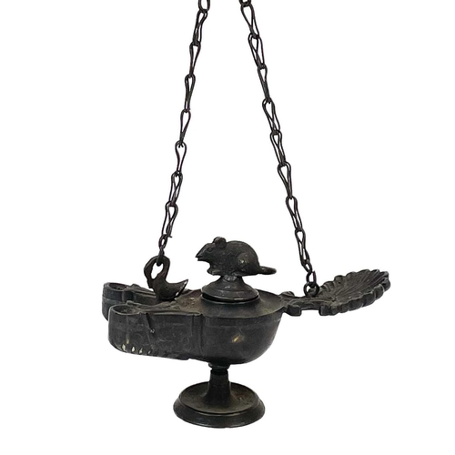 148 - Two 19th century bronze miniature lamps. Each with twin spouts and shell thumbpieces, one with a phe... 