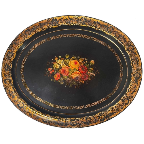 153 - A Victorian black lacquered papier-mâché mache oval tray. Painted with a central floral bouquet with... 