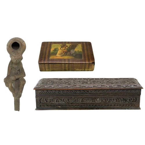 170 - A Victorian papier-mâché snuff box. Decorated lovers in a landscape, width 9cm, together with a clay... 