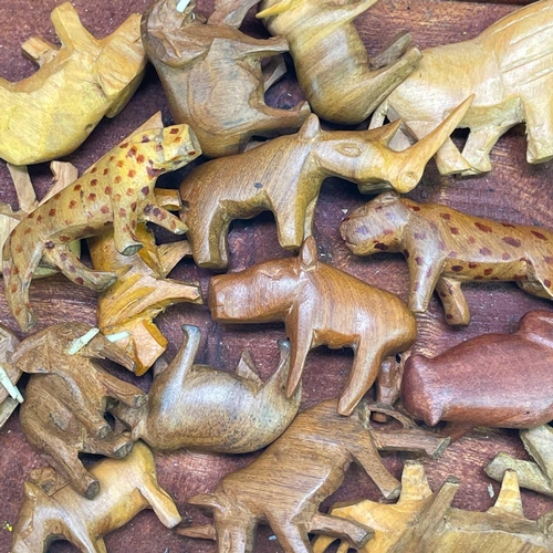 185 - Noah's Ark with various African wood carved animals. Height 16cm width 41cm depth 16.5cm.